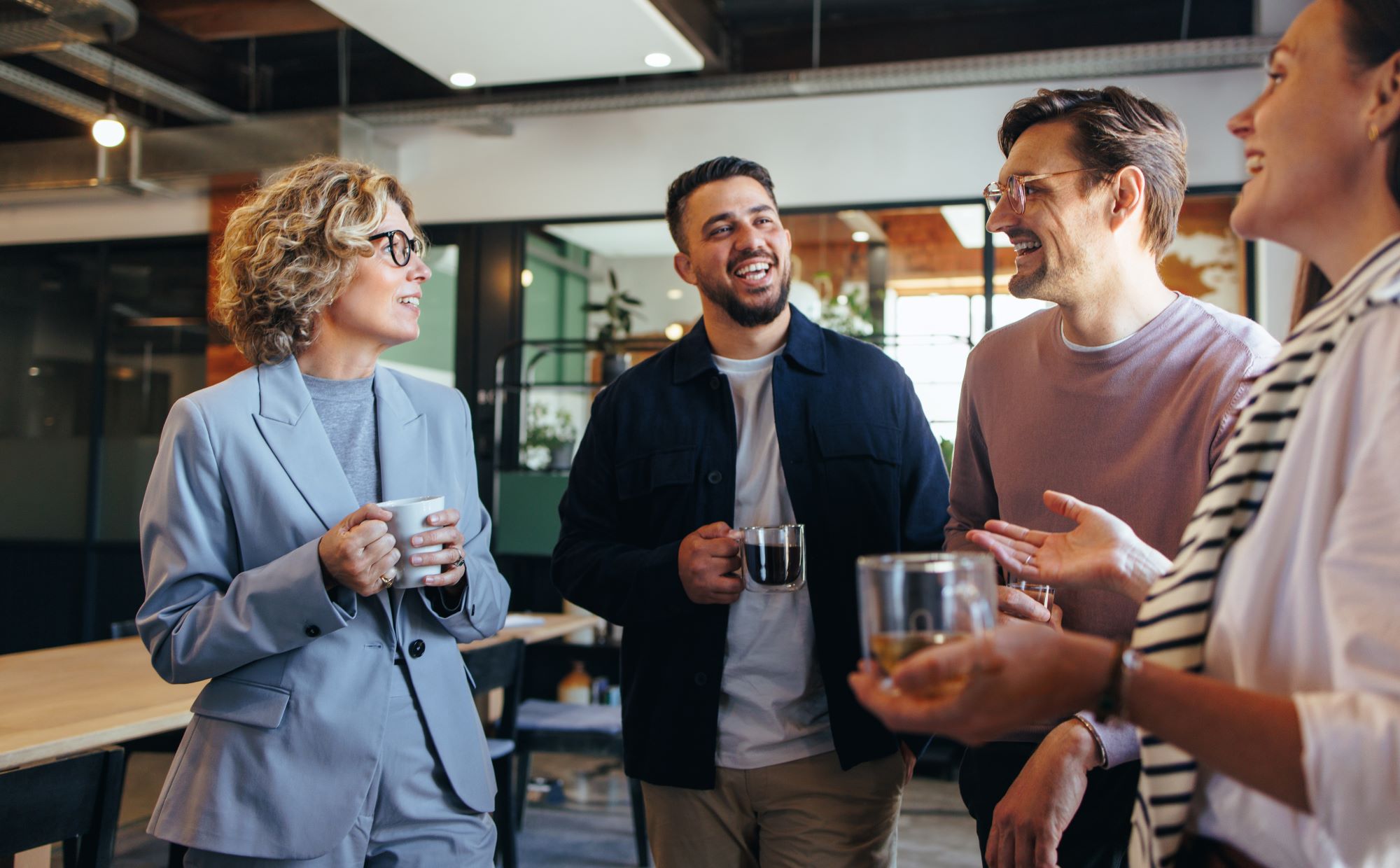 Coworkers having a coffee break, chatting 