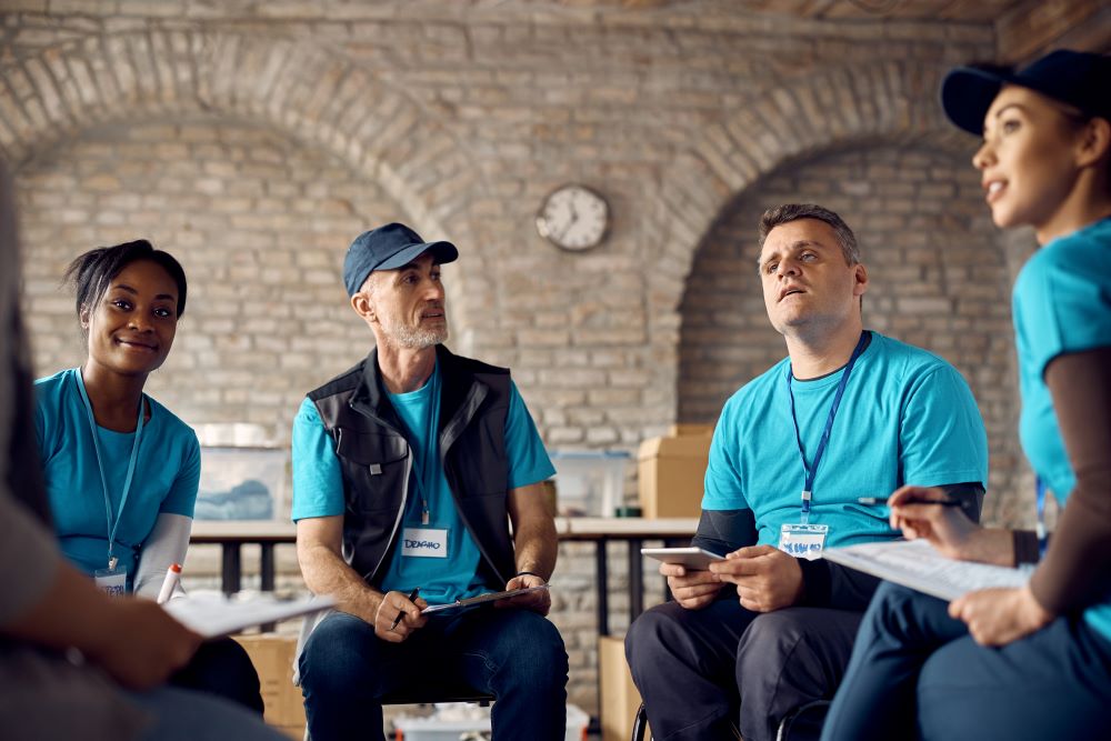 members of a non profit organization having a meeting in a circle